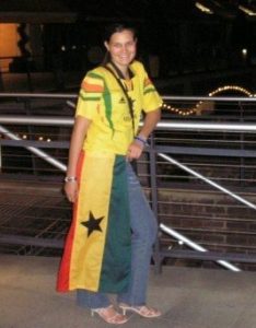 International Sports Psychologist Caren wearing a Ghana soccer jersey 